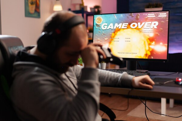 Player using a laptop to browse online games on 100PlayMates